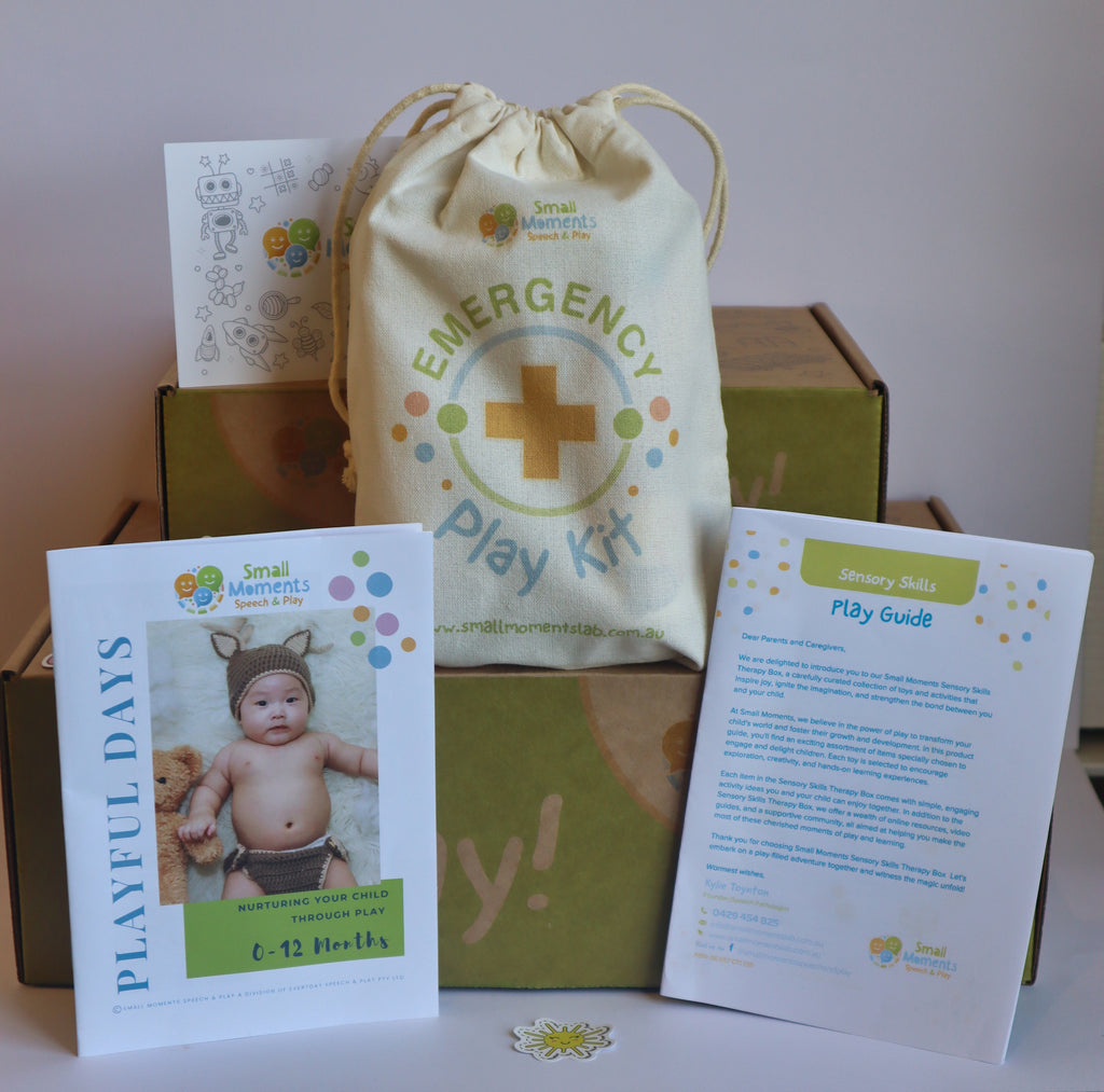 Image shows the emergency play kit, small and large boxes, therapy activity play guide, playful days guide for 0-12 months old.